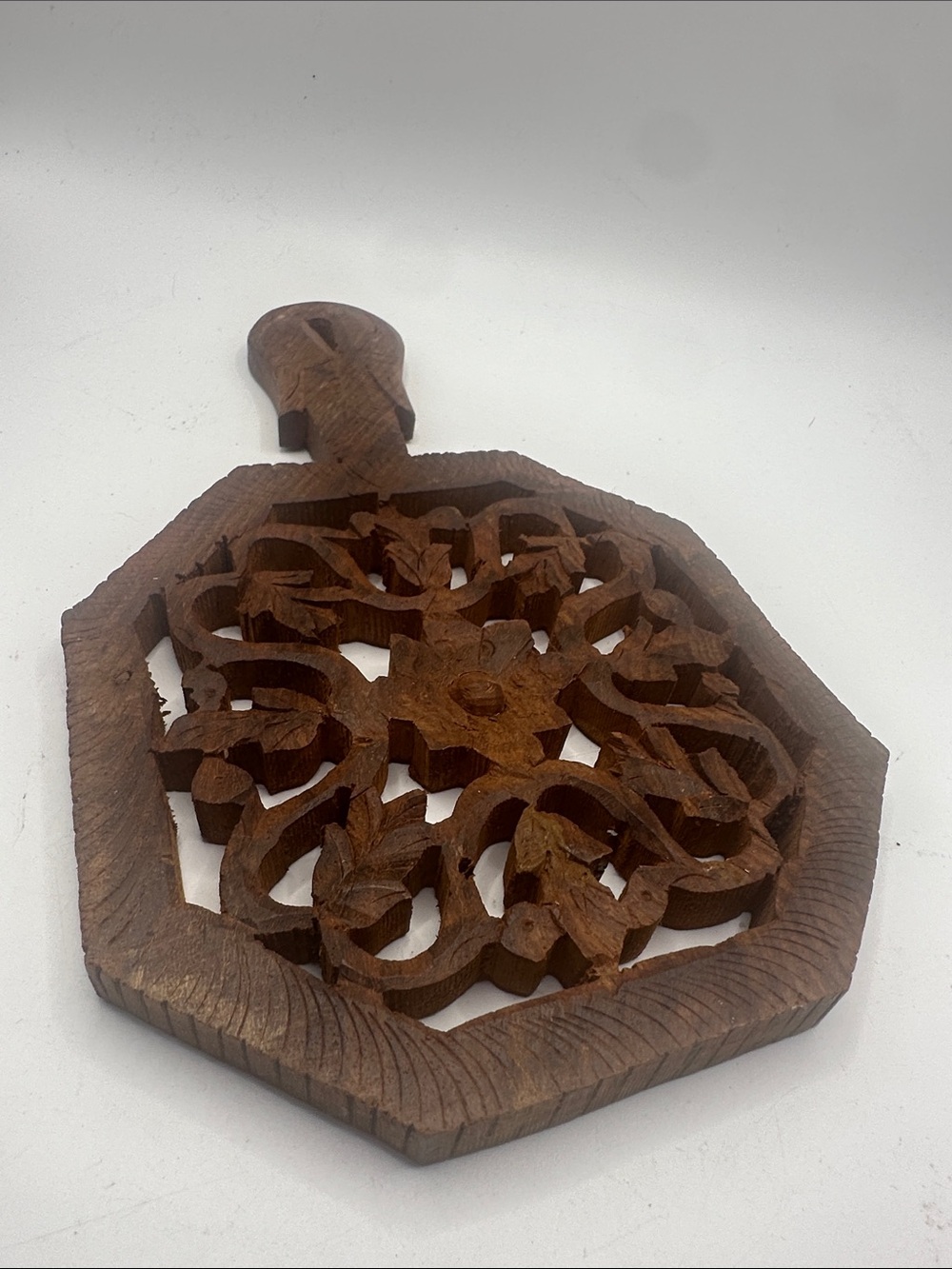 Hand-Carved Brown Wooden Trivet with Floral Lattice